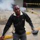 A protester bleeds after clashes with police in Nairobi.